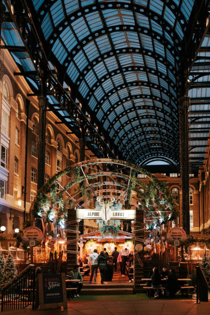 Night view of Hays Galleria with its iconic glass ceiling, showcasing urban architecture and vibrant nightlife.