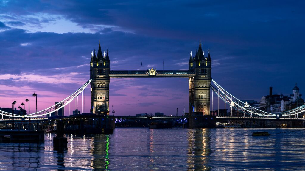 Beautiful view of Tower Bridge at twilight with reflections in the River Thames.